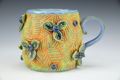 Orange Cup with Leaves and Blueberries